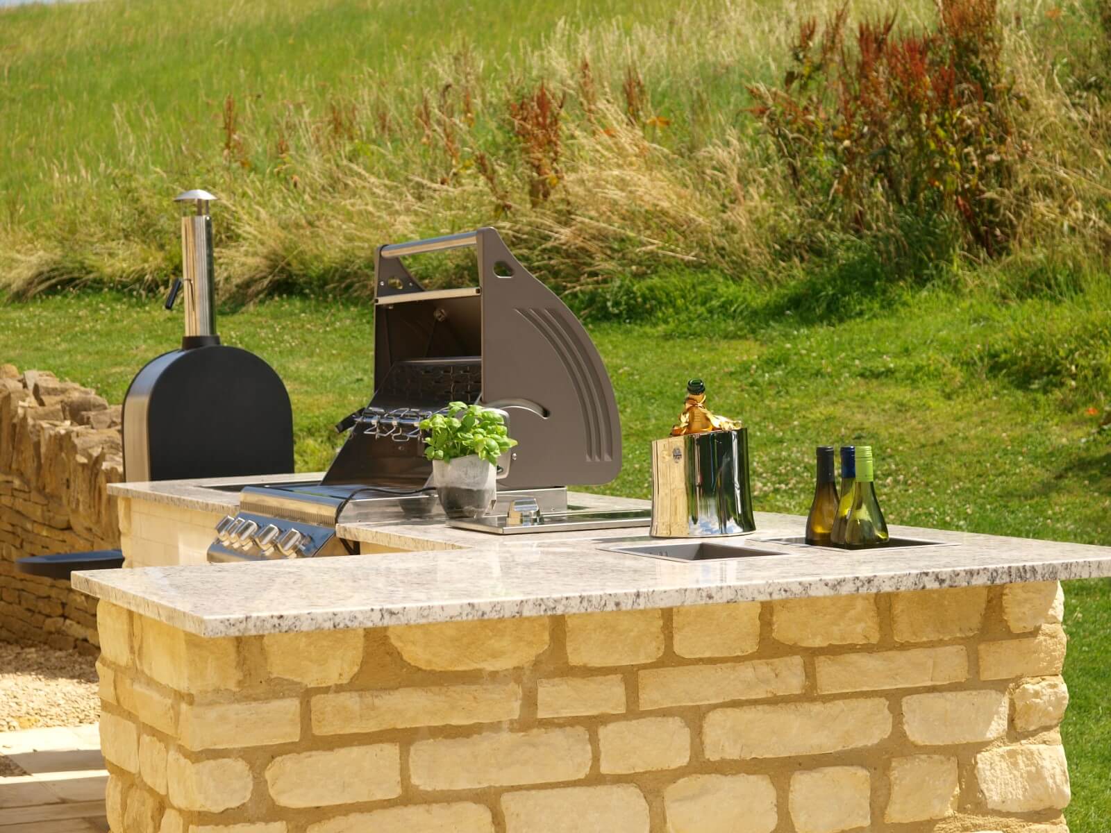 Outdoor Kitchen with Breakfast Bar in Natural stone