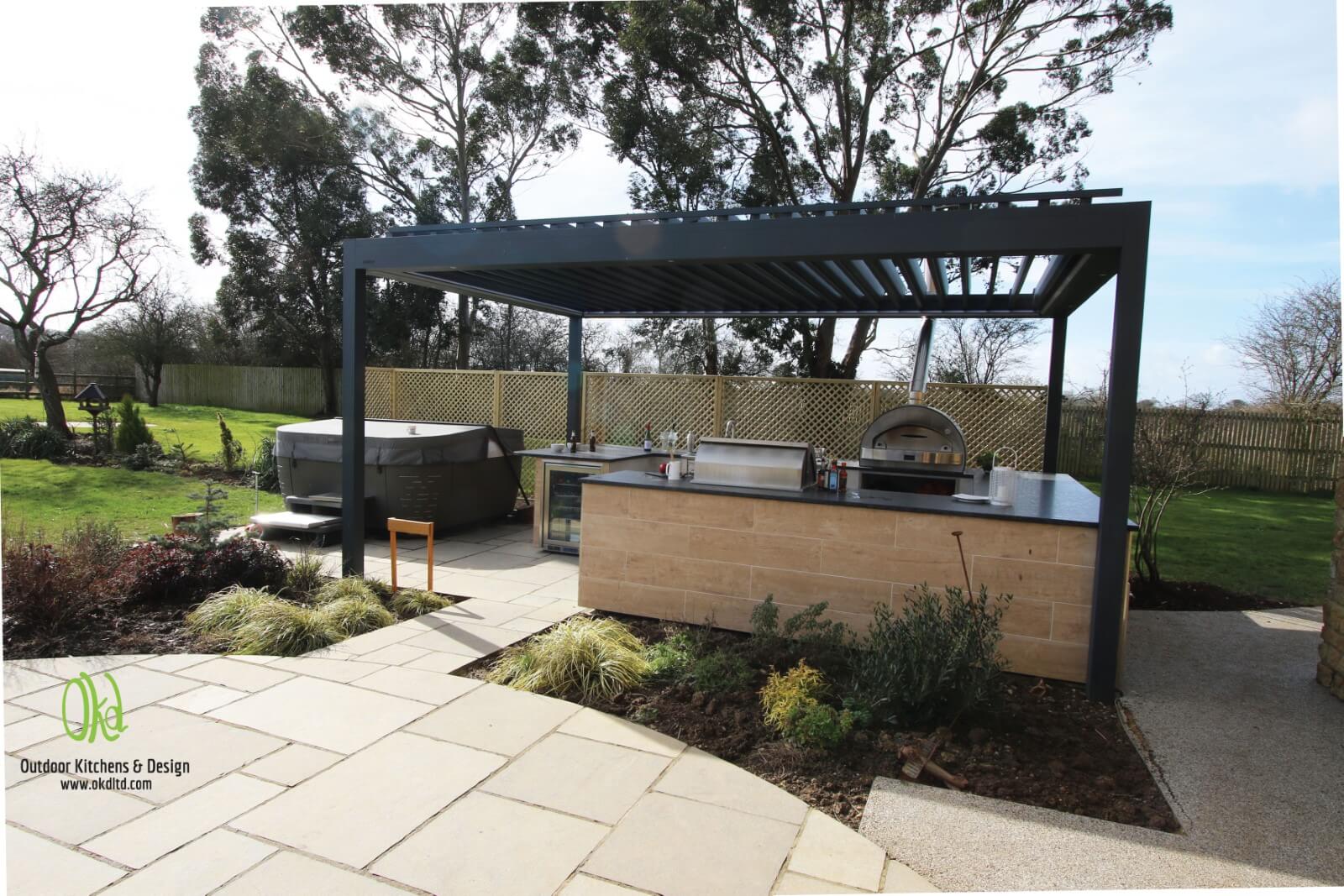 Bespoke outdoor kitchen with anthracite grey pergola
